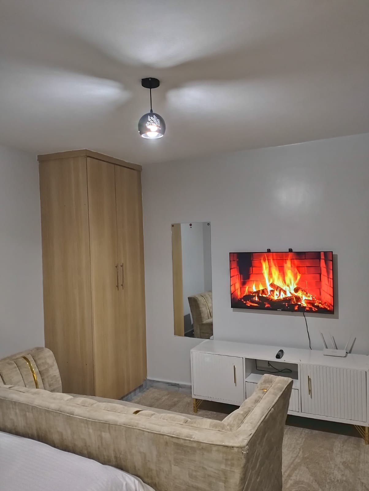 Cozy living room with TV at Dynamic Studio near JKIA